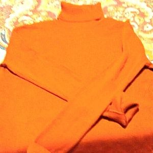 Large ribbed knit turtleneck from Flamingo brand.